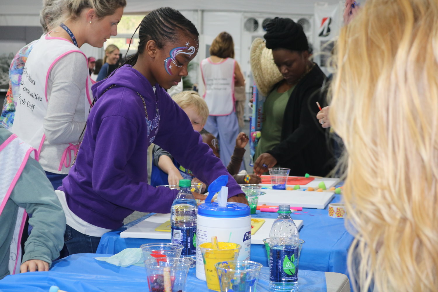 Kids at the event enjoys painting and arts and crafts.